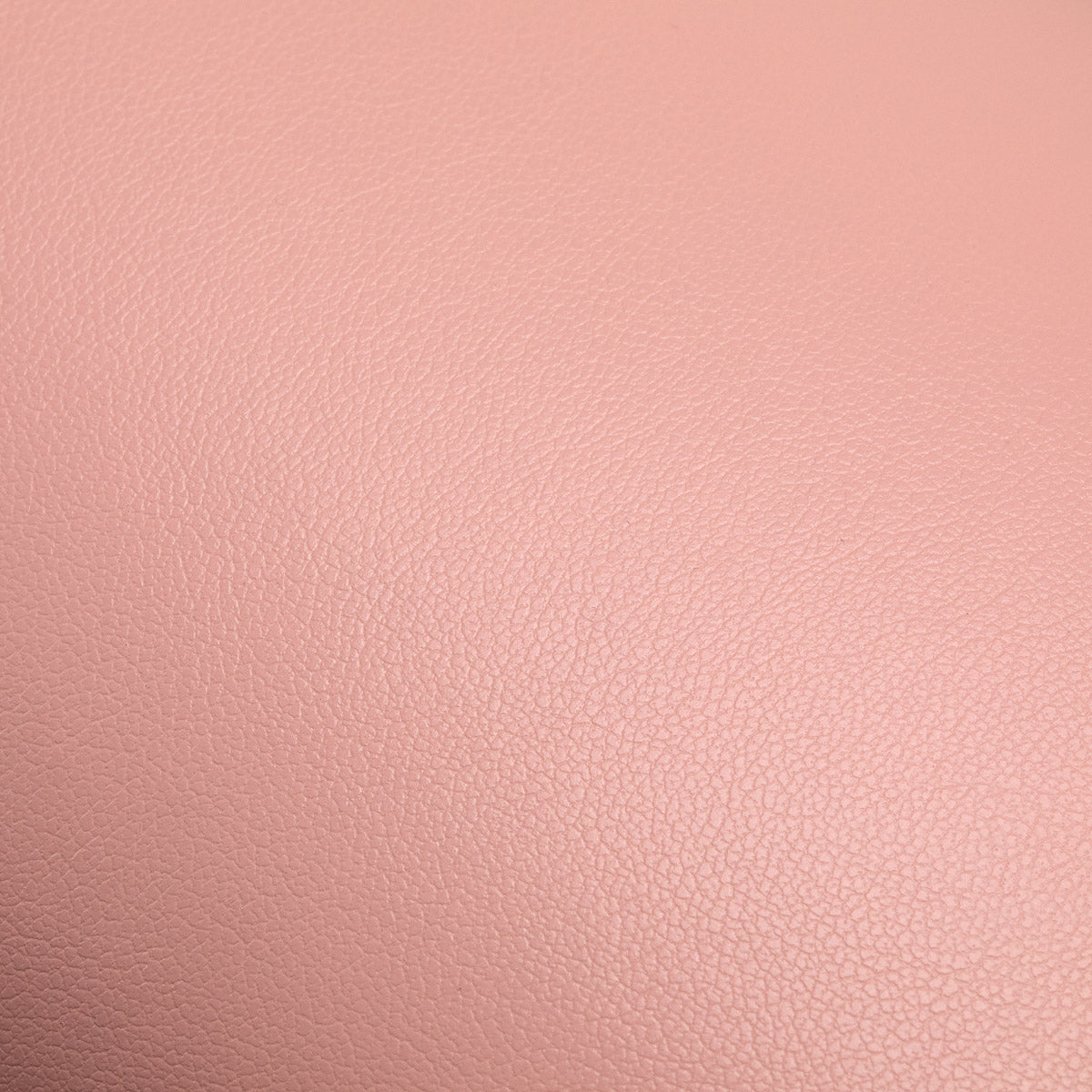 Pink Manicure Support Momo 7-M from MOMO, a beauty salon furniture piece with a cushioned surface for nail care.