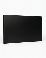Black leather-bound book on a white background