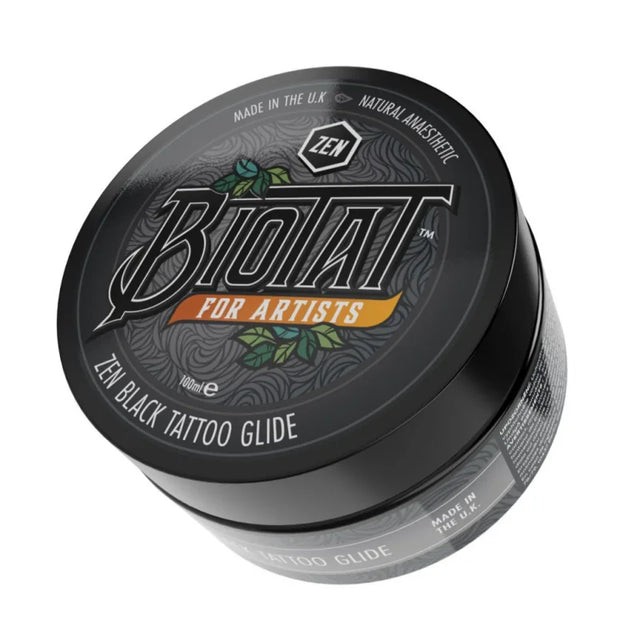Biotat Zen Black Tattoo Glide 100g jar showing black tattoo lubricant with label and open lid, used for tattooing.
