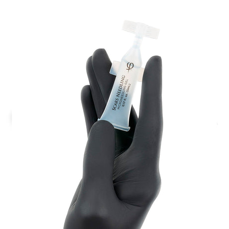 PhiAcademy Scars Needling Microneedling Gel 5ml 5pcs — individual Scars Needling gel ampoule held in a gloved hand