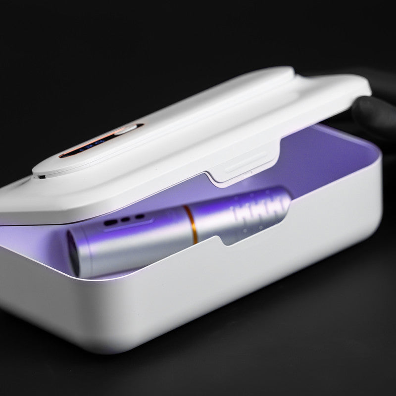 UV sterilizer for tattoo machines from BVShop, showing the compact sterilization device with clear lid and control panel.